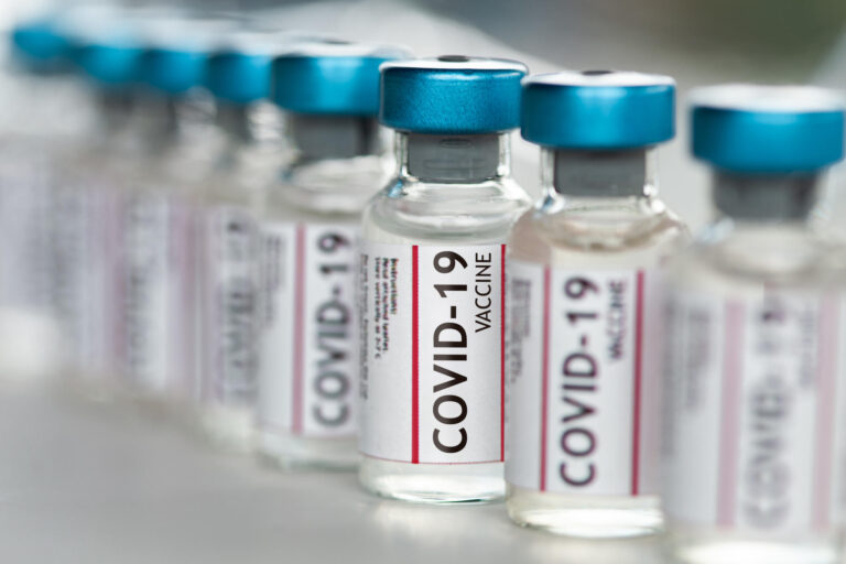 Covid 19 Coronavirus Vaccine vials in a row macro close up
