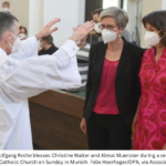 The Rev. Wolfgang Rothe Blesses Christine Walter And Almut Muenster During A Service At St. Benedict’s Catholic Church On Sunday In Munich.